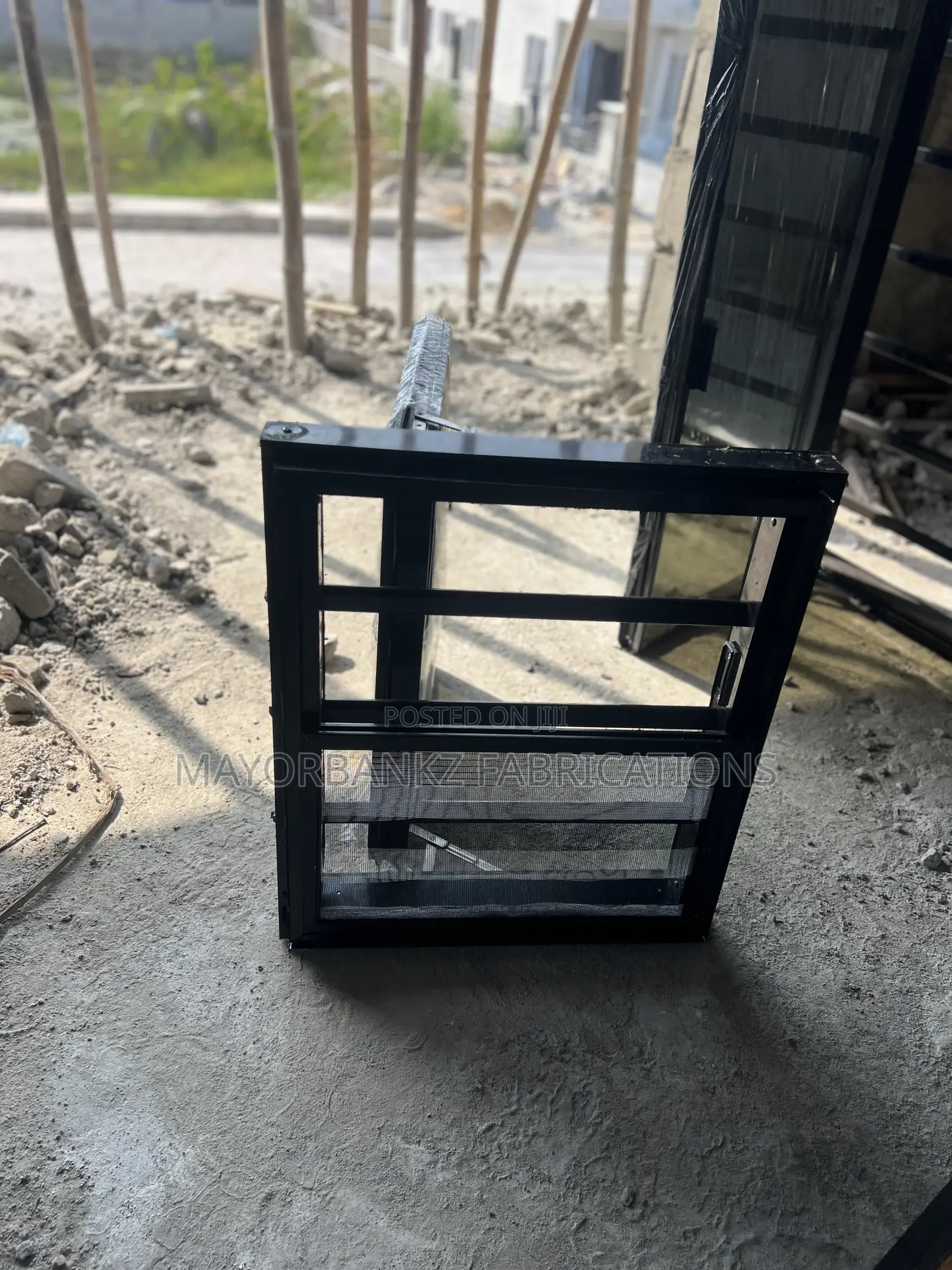 Frameless Window With Black Profile And Gray Glass