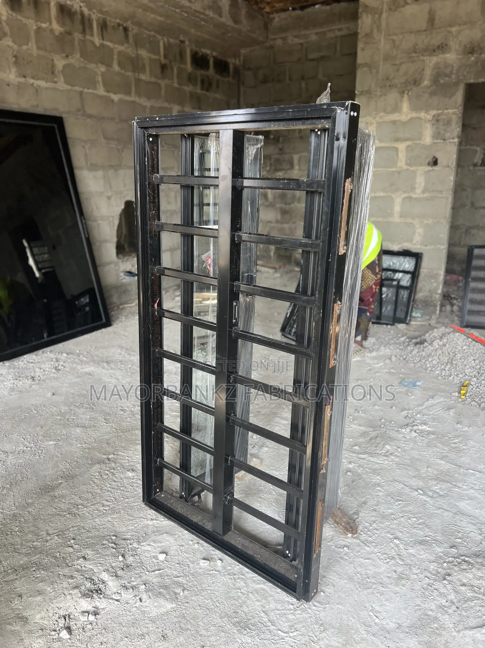 Frameless Window With Black Profile And Gray Glass
