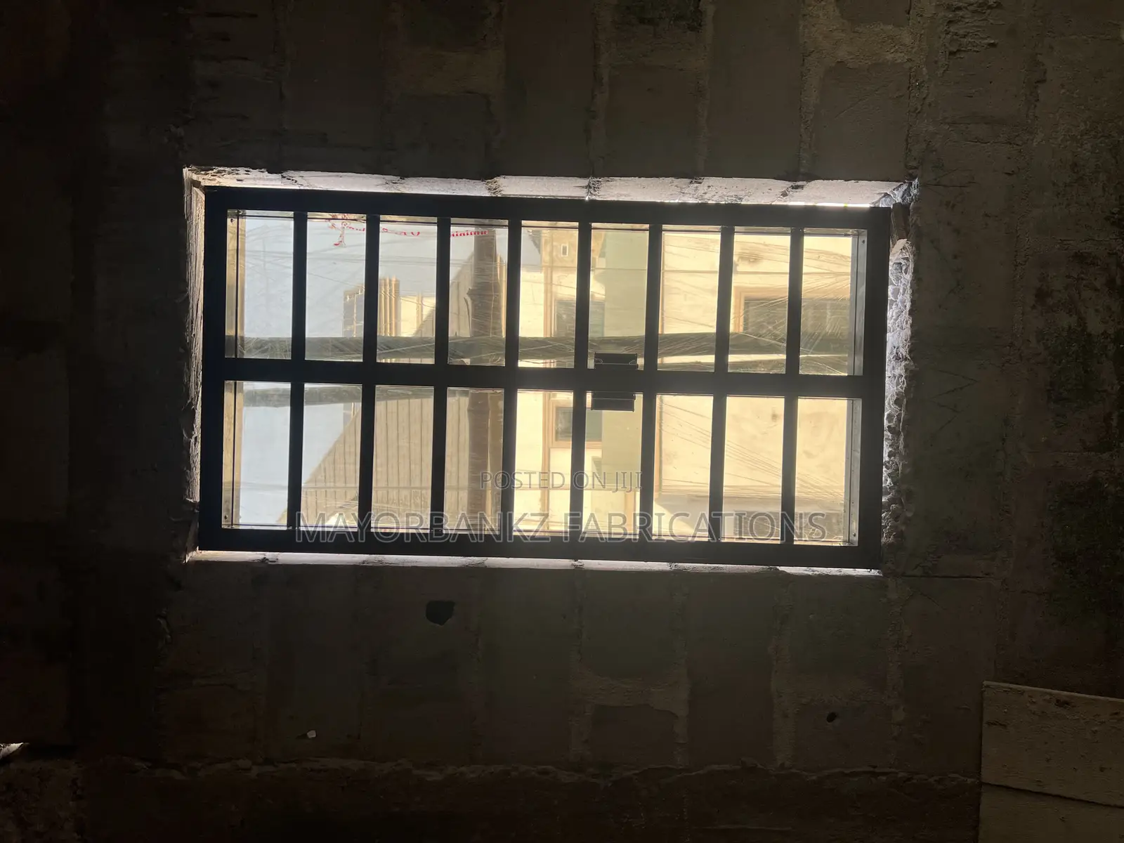 Frameless Window With Black Profile And Gray Glass
