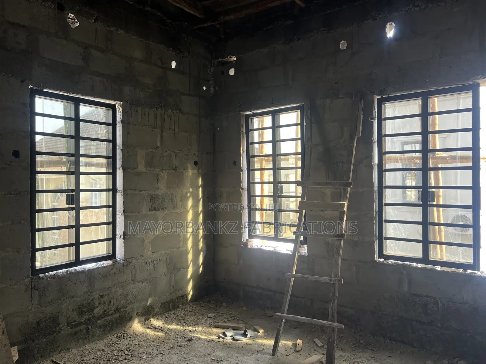 Frameless Window With Black Profile And Gray Glass