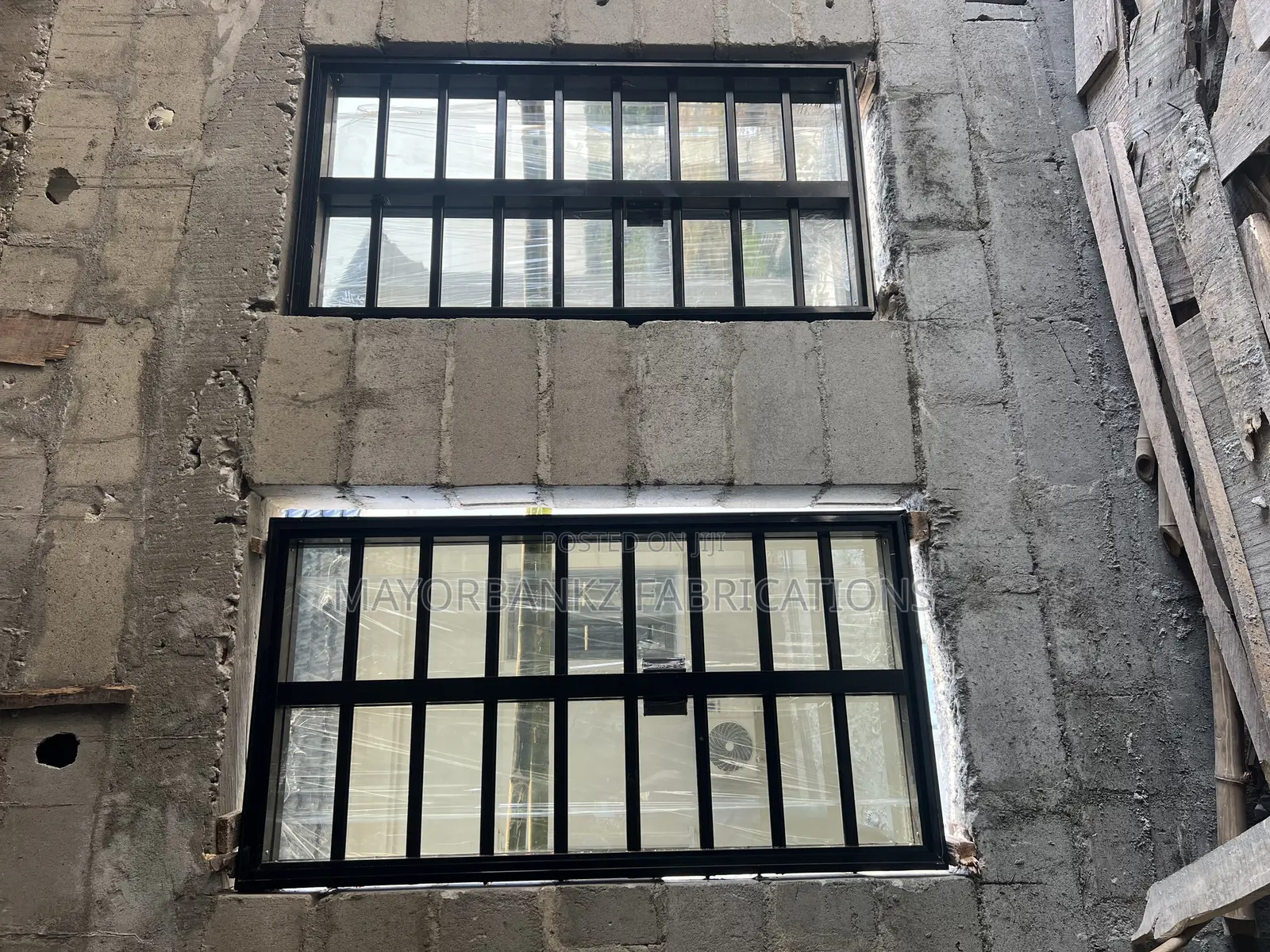 Frameless Window With Black Profile And Gray Glass
