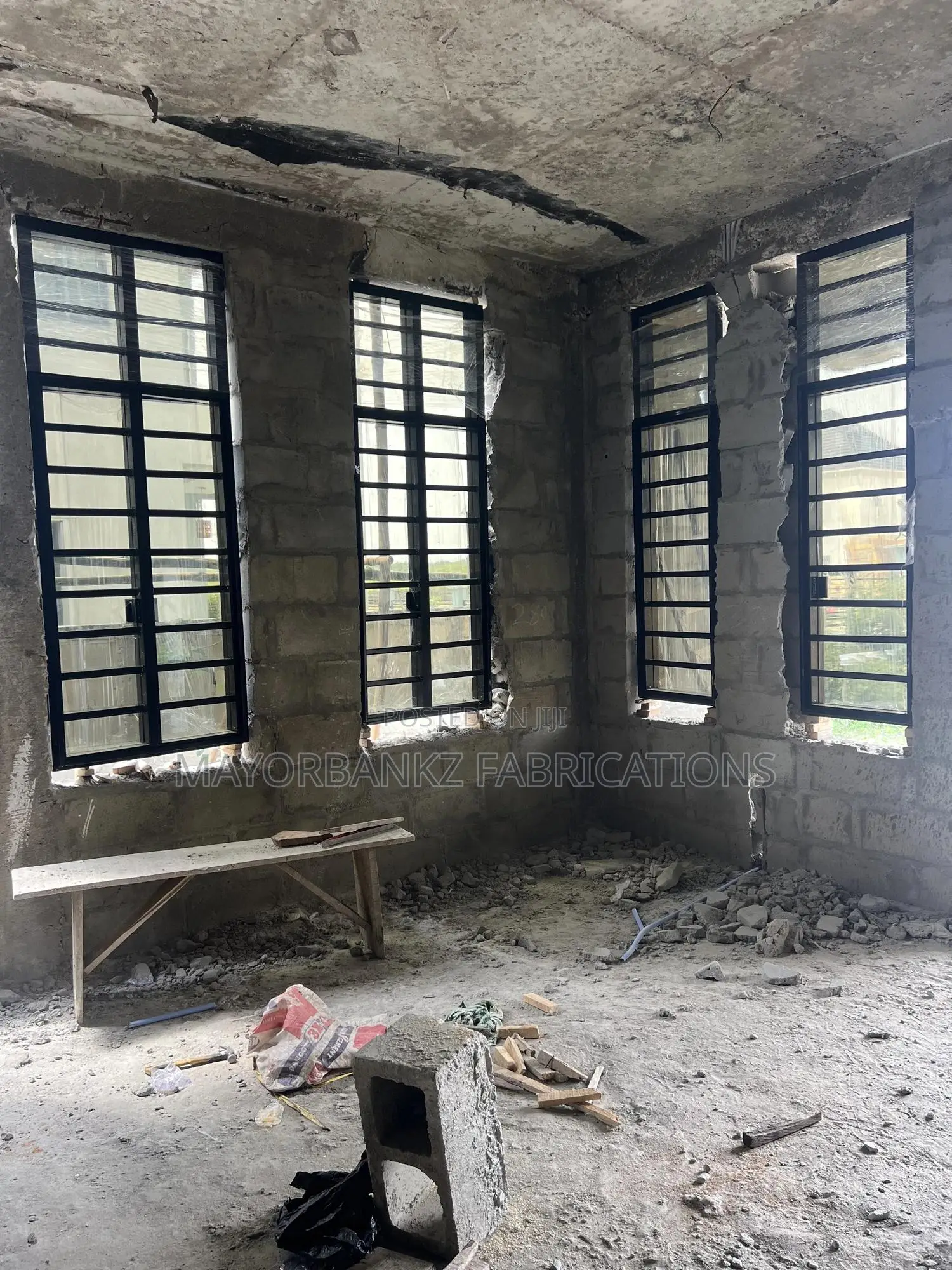 Frameless Window With Black Profile And Gray Glass