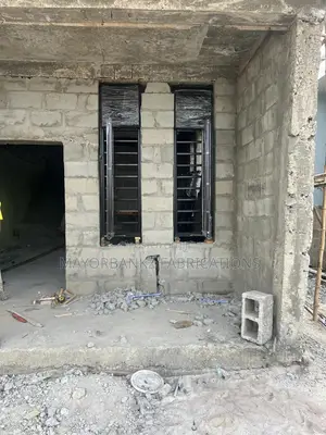 Frameless Window With Black Profile And Gray Glass