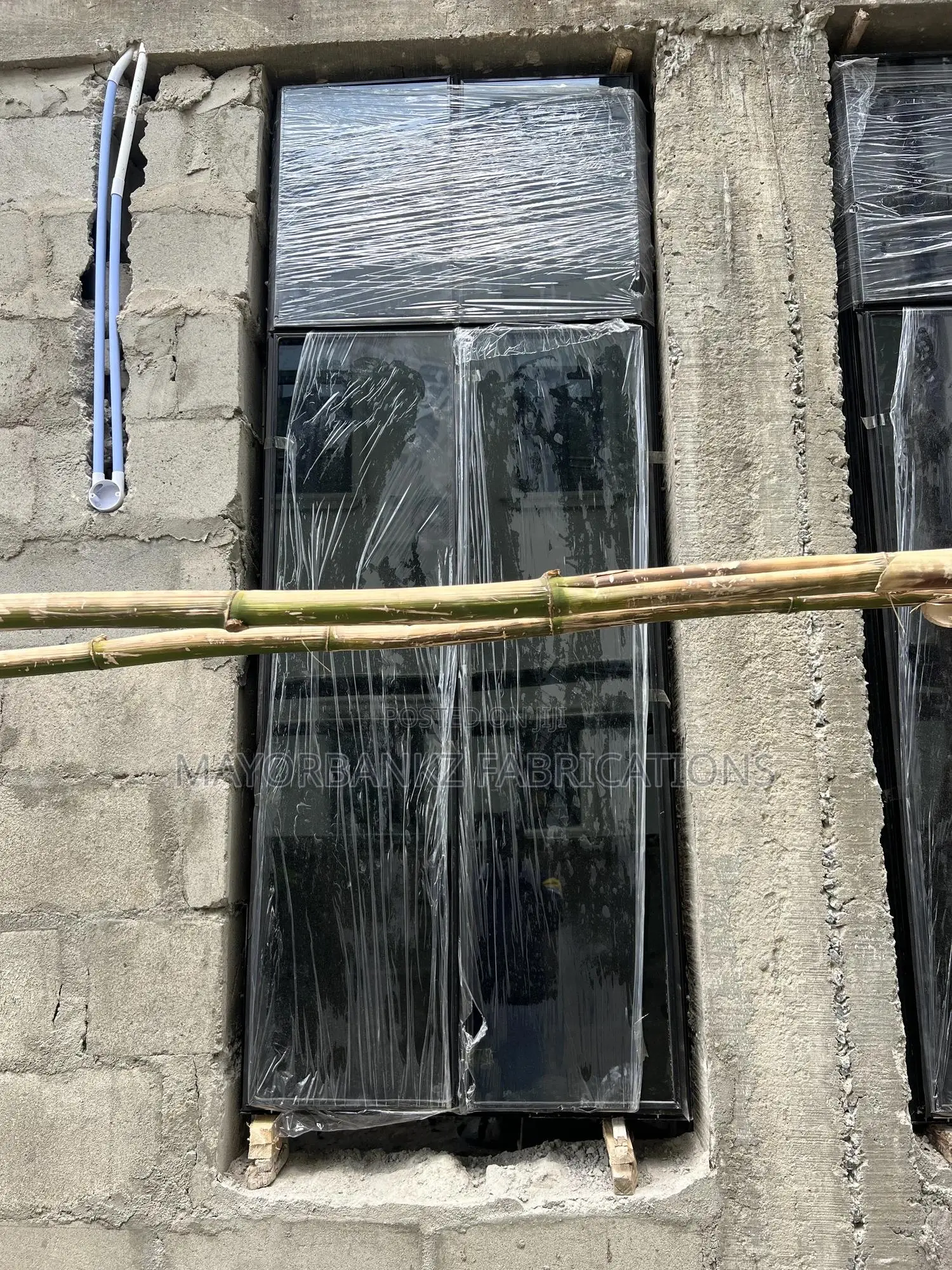 Frameless Window With Black Profile And Gray Glass