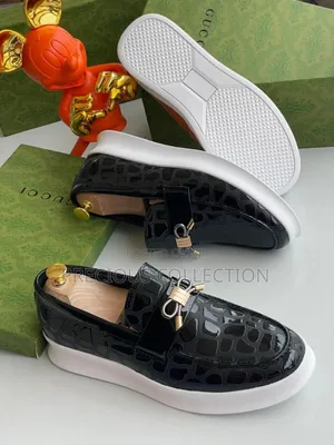 Men's Gucci Glossy Leather Loafers