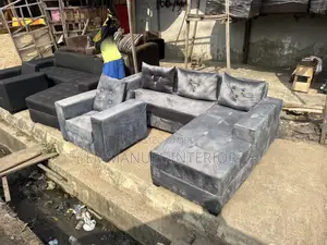 A Standard L Shape Grey Sofa
