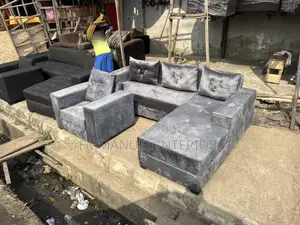 A Standard L Shape Grey Sofa