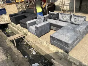 A Standard L Shape Grey Sofa