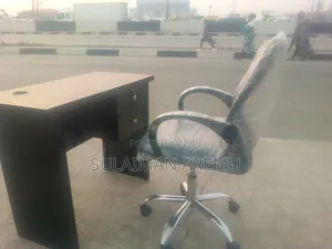 Photo - Office Table an Office Net Chair