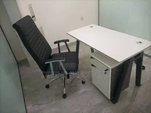 A Set of Office Desk and Chair With Movable Drawer.