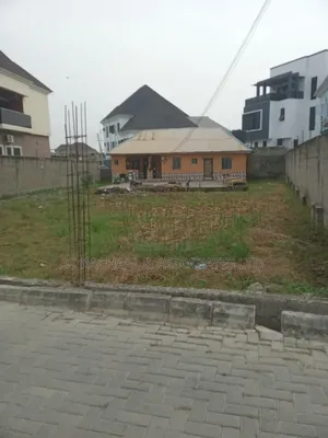 A Dry Plot of Land With Setback Bungalow for Sale