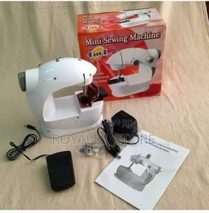 Photo - Electric Mini Sewing Machine
