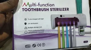 Toothpaste Dispenser/Toothbrush Steriliser