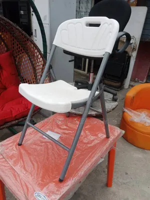 Photo - White Foldable Plastic Chair