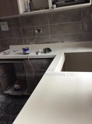 Kitchen Cabinets And Corian Worktop Installation