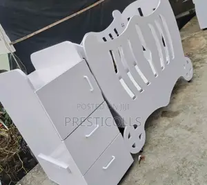 Photo - White Wooden Baby Crib and Drawer