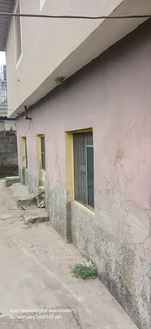 Two Buildings One Completed And The Other At Lintel Level