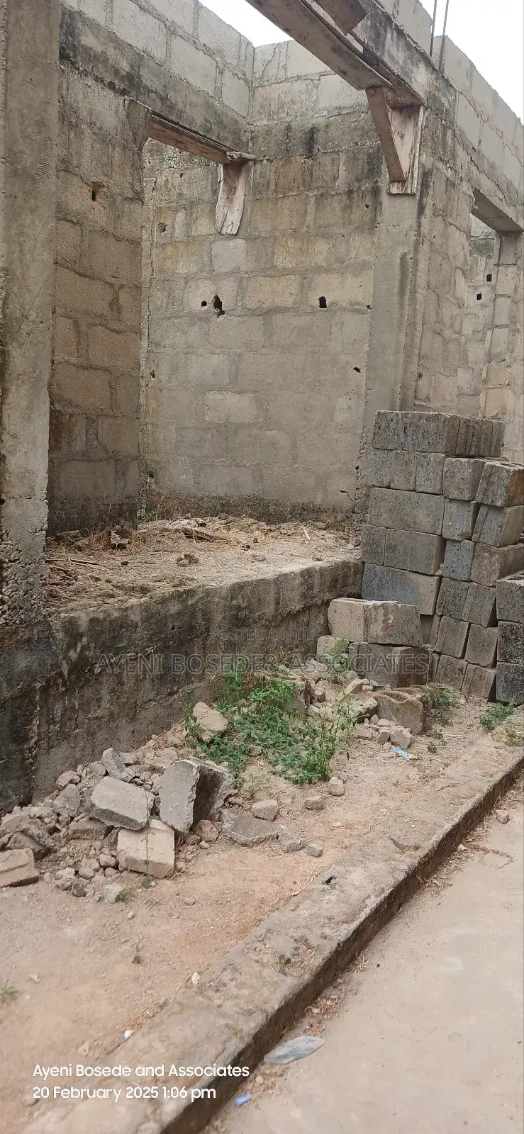Two Buildings One Completed And The Other At Lintel Level