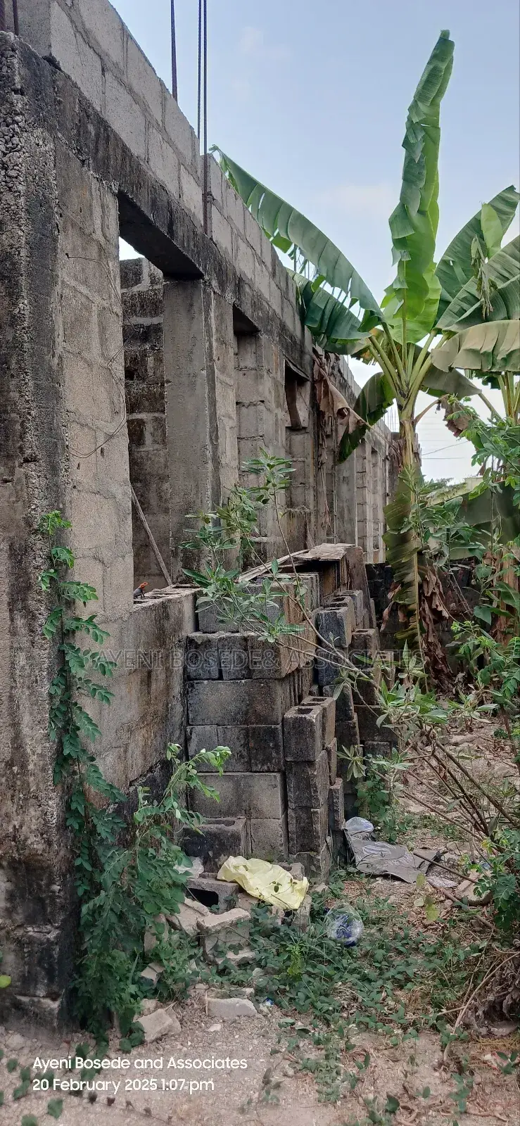 Two Buildings One Completed And The Other At Lintel Level