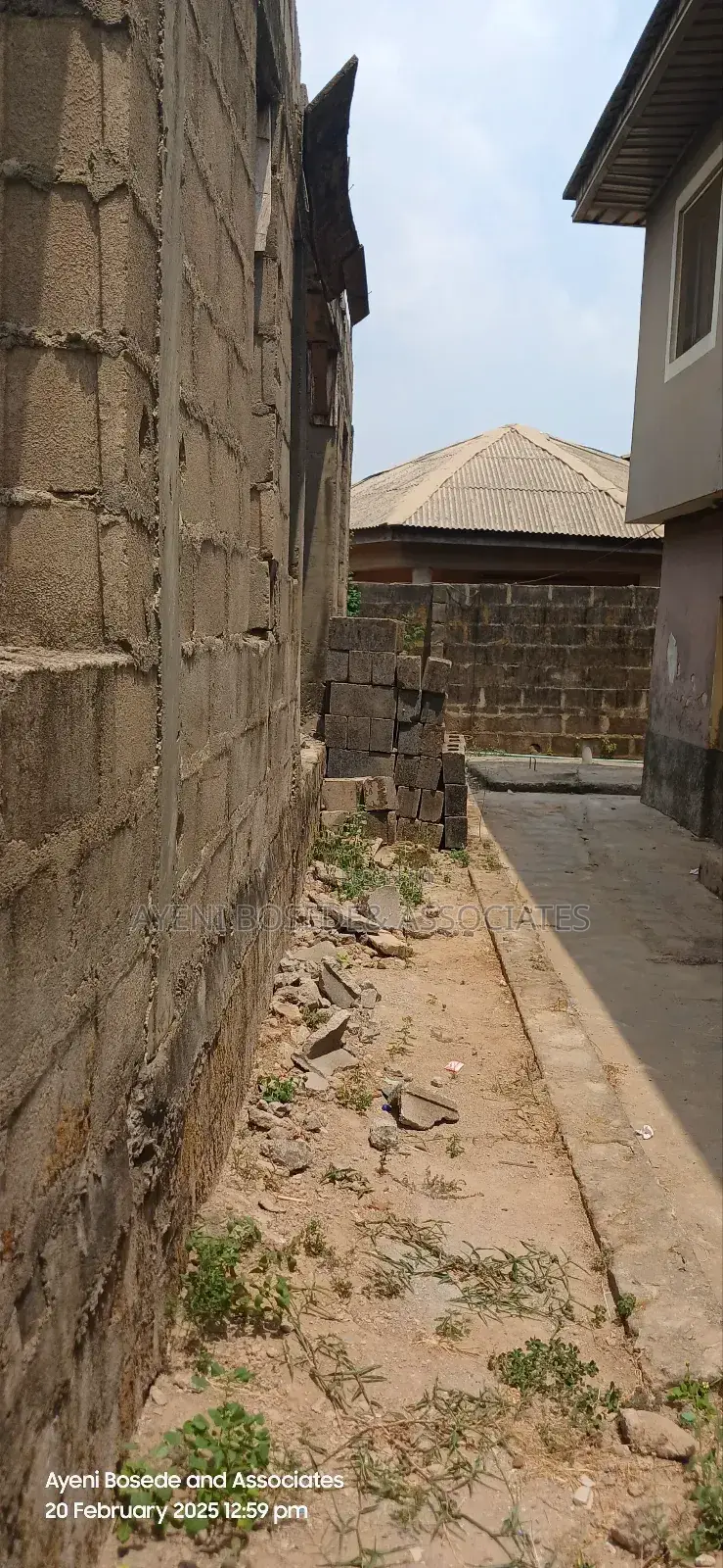 Two Buildings One Completed And The Other At Lintel Level