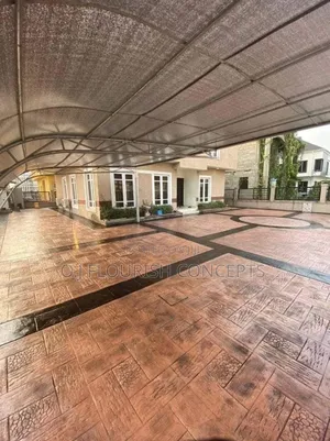 Black Touches on Orange Stamped Concrete Flooring