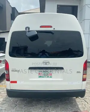 Air-Conditioned White Toyota Hiace for Rent.