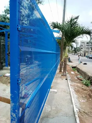 Complex Fencing Seen Through Mesh Wires