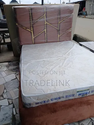 White Mattress and Brown Bed Frame
