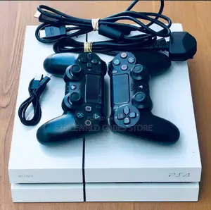 Ps4 White Console With 2 Controllers Plus Games Installed