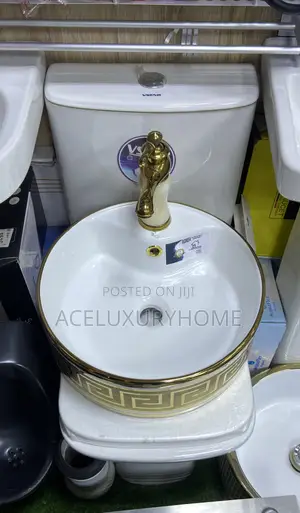 Gold and White Countertop Basin With Faucet