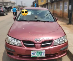 Photo - Nissan Almera 1.6 Comfort 2006 Red