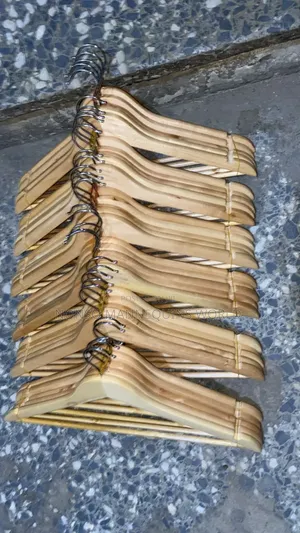 Near Packs Of Wooden Hangers For Clothing