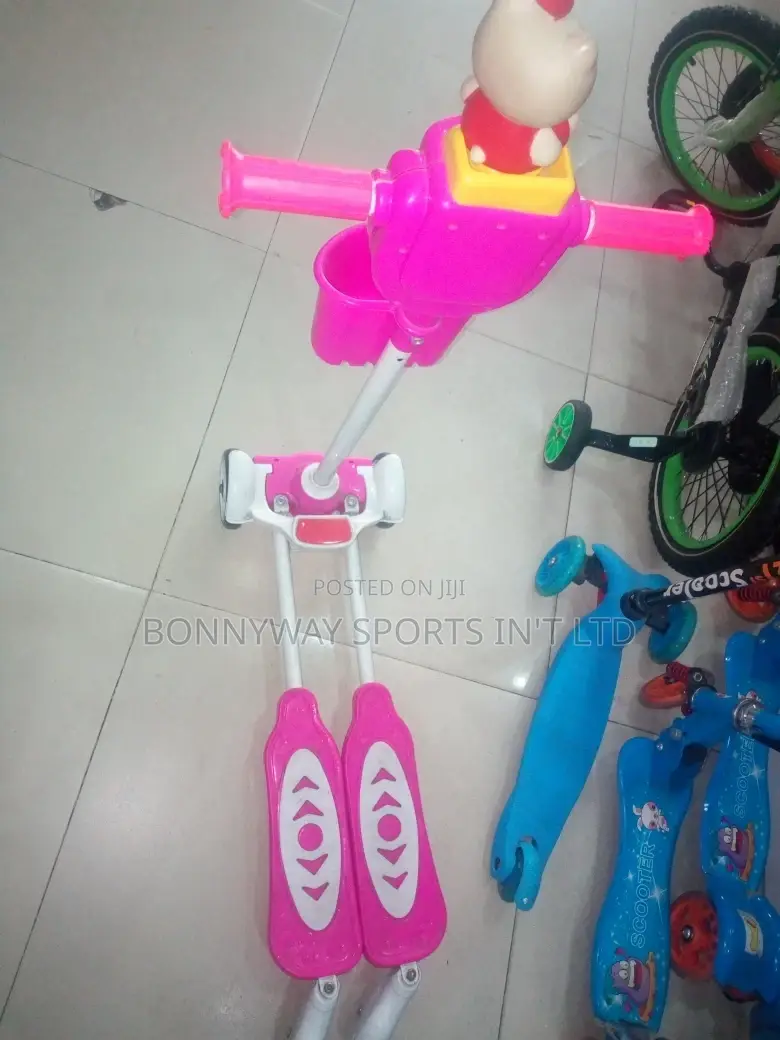 Children Riding Scooters