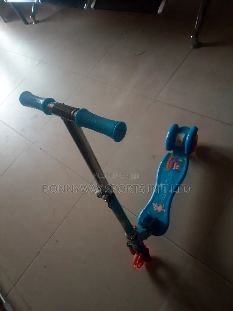 Children Riding Scooters