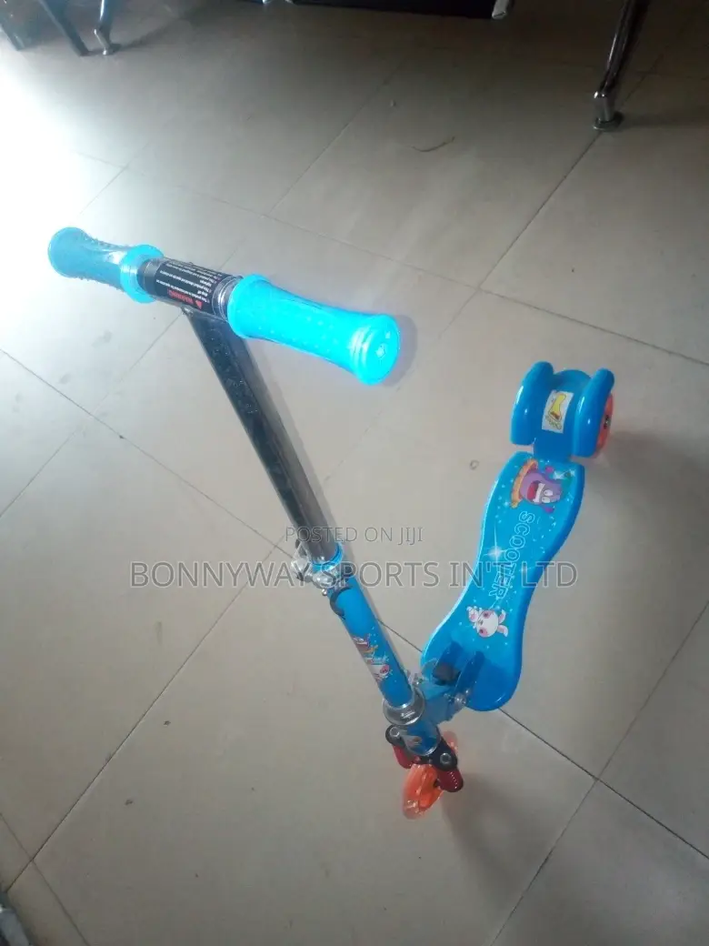 Children Riding Scooters