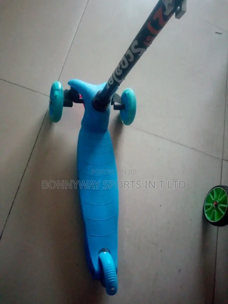 Children Riding Scooters
