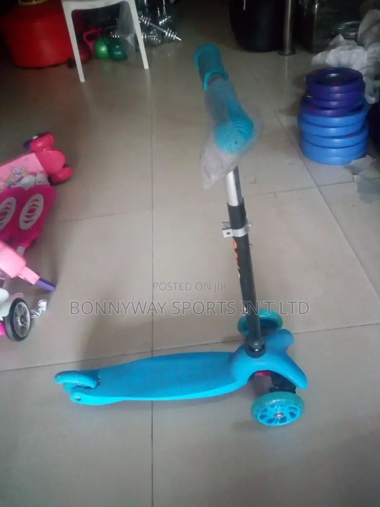 Children Riding Scooters