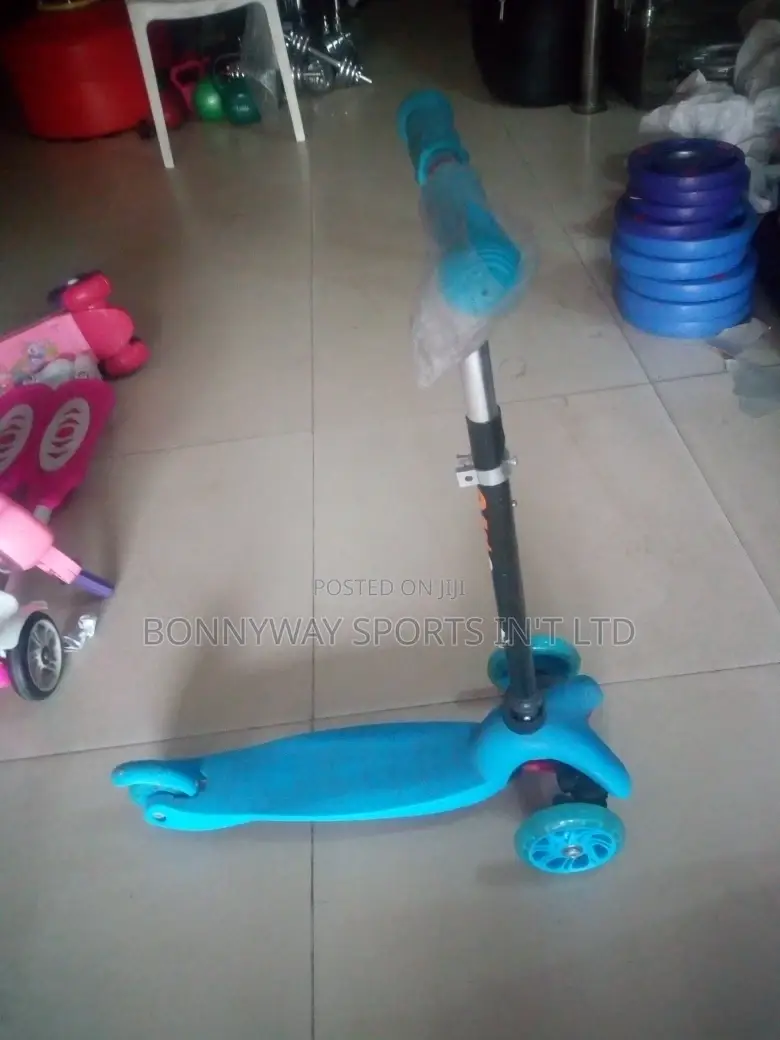 Children Riding Scooters