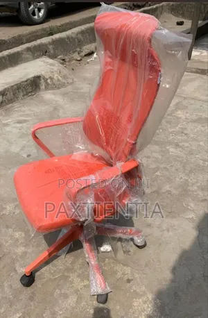 Curved Orange Swivel Chair