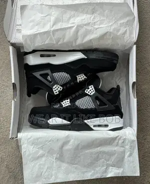 Photo - Premium Nike Air Jordan 4. Retro White Thunder