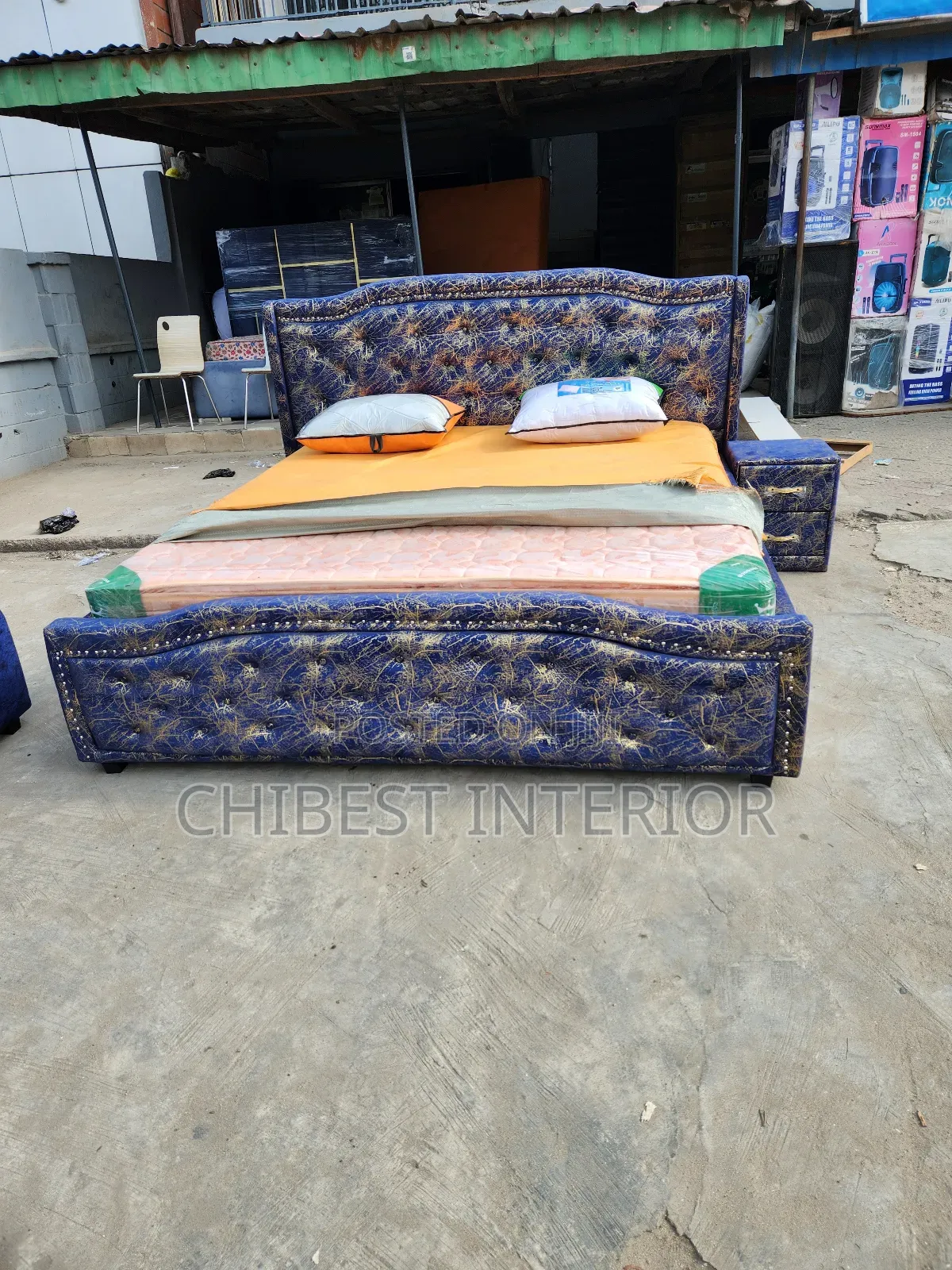 An Upholstery 6by6 Bed With a Two Step Drawer