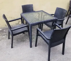 Photo - Outdoor Sets With 4 Chairs and a Glass Table Top.