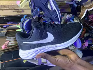 Photo - Black Nike Shoe and Timberland