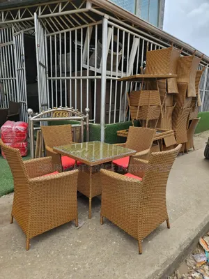 Wicker Patio Chairs With a Glass Table.