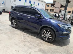 Honda Pilot Touring 4dr SUV (3.5L 6cyl 9A) 2017 Red