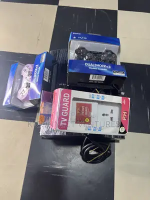 Photo - Playstation 3 With Games Installed Inside and Tv Guard