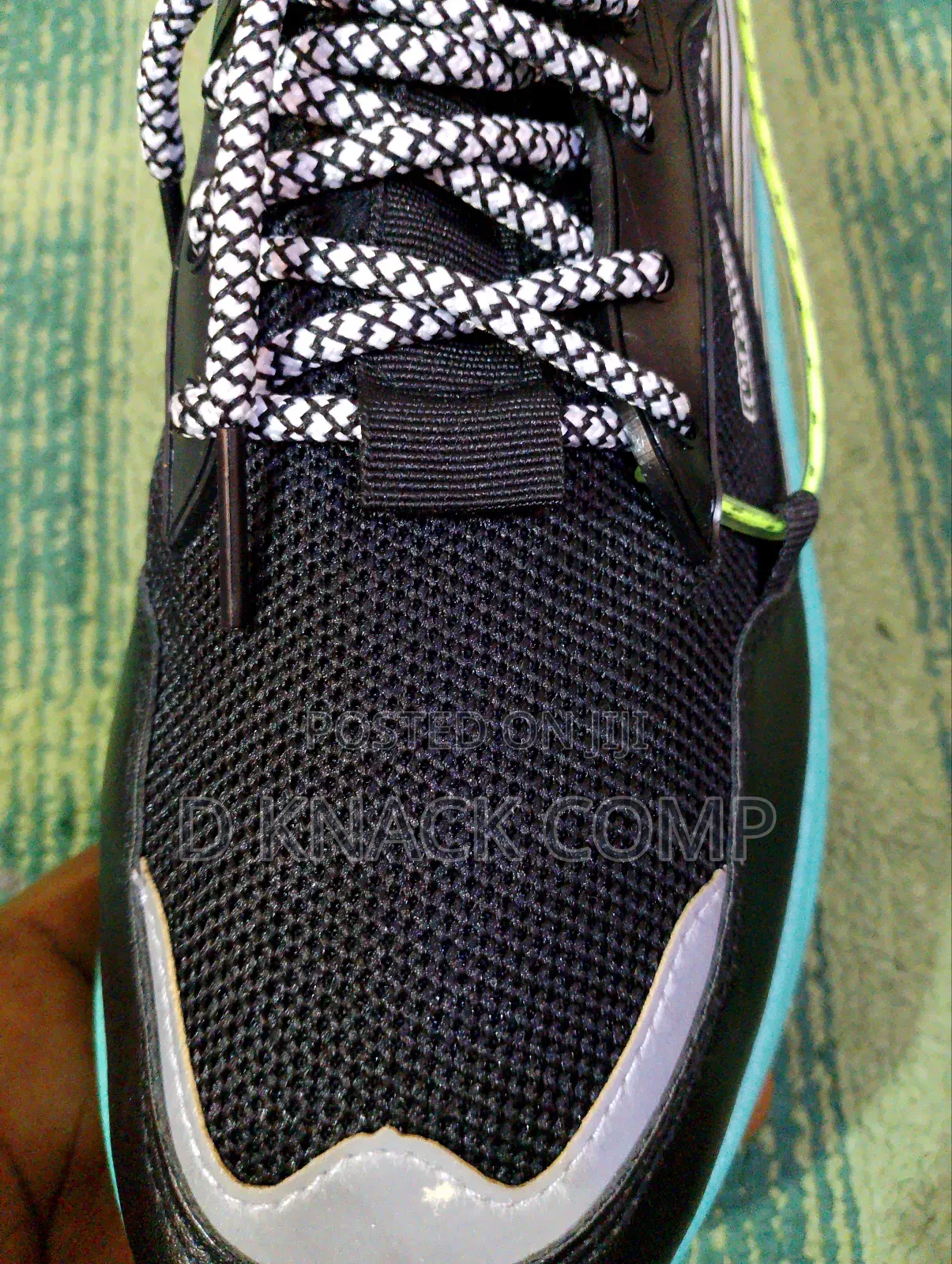 Black Running Snacker With a Touch of Green