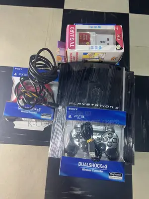 Photo - Playstation 3 With Tv Guard and All Accessories,Games Instal