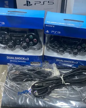 Photo - Ps 3 Super Slim With Games and 2 Pads