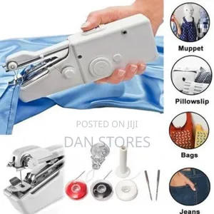 Photo - Hand Held Sewing Machine
